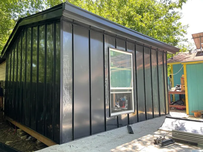 Black standing seam metal wall panels for Roof Inspection in North Mankato